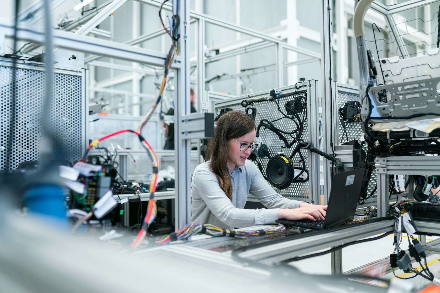 Engineer validating components on a production line